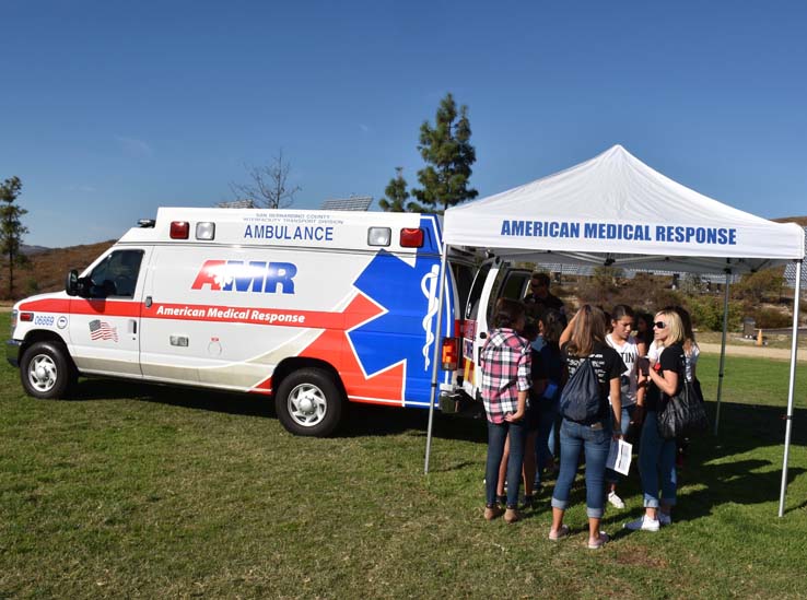 Ambulance and people at Allied Health and Medical Careers day
