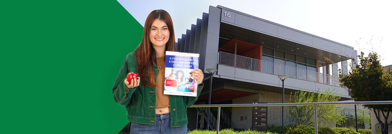 Woman holding a textbook and apple