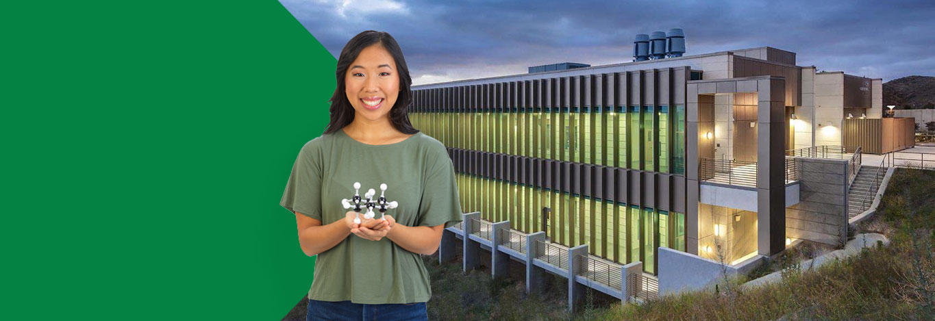 Woman holding molecular model