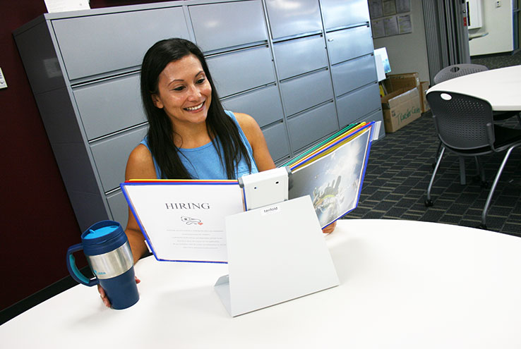 Woman looking through career book