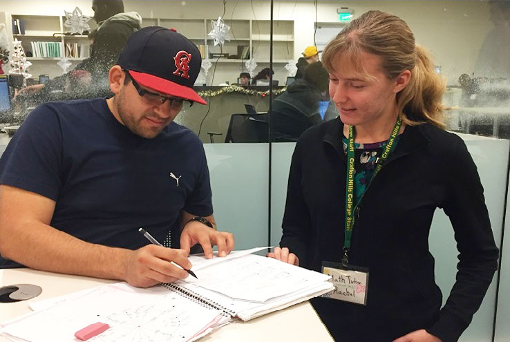 Photo of student working with tutor