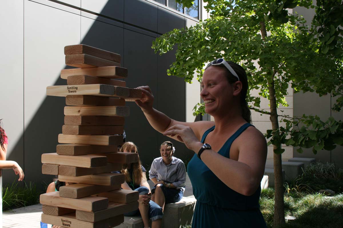 People playing giant Jenga