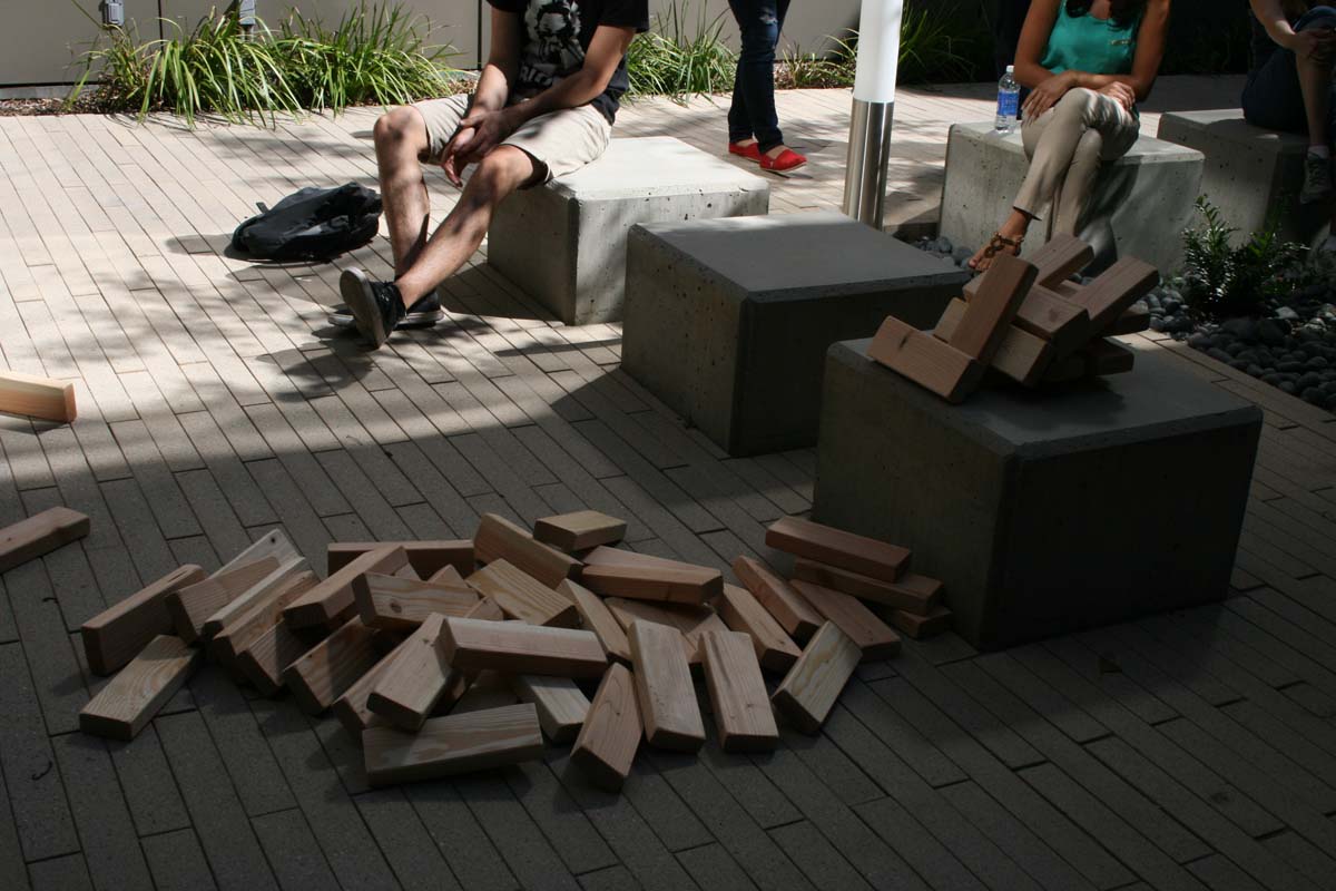 People playing giant Jenga