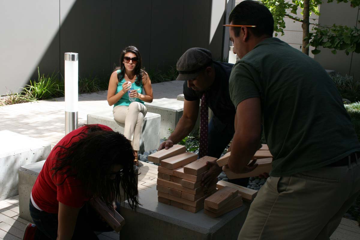 People playing giant Jenga