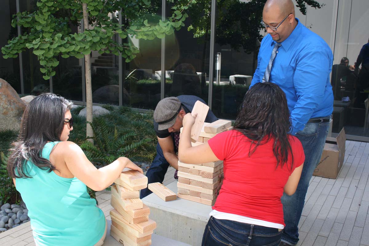 People playing giant Jenga