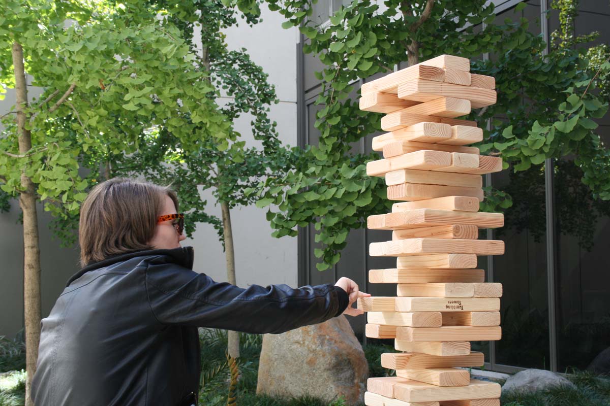 People playing giant Jenga