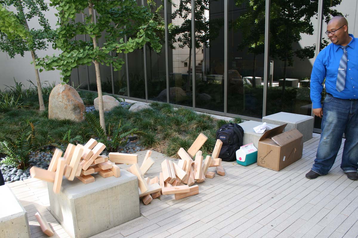 People playing giant Jenga