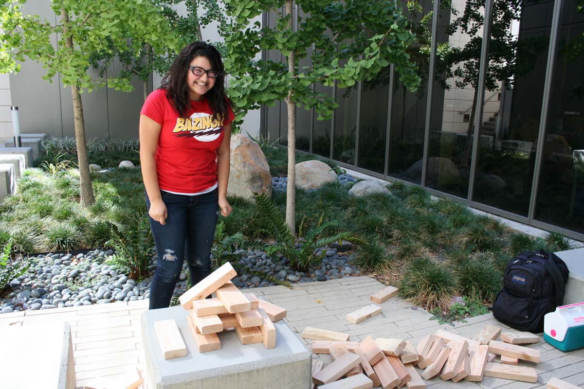 People playing giant Jenga