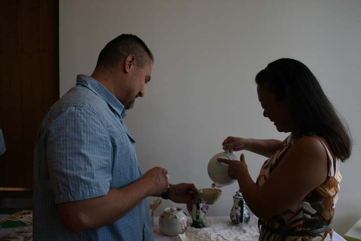 People enjoying Tea with the Deans