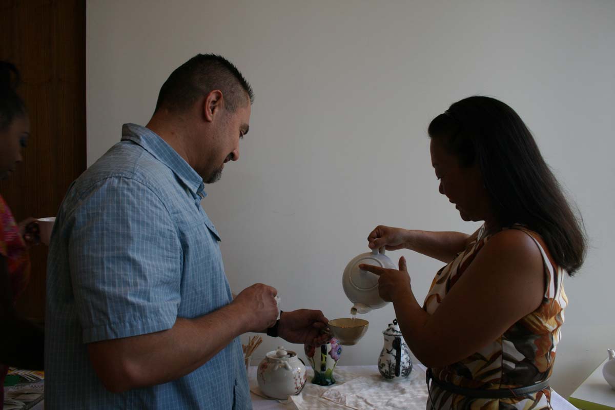 People enjoying Tea with the Deans