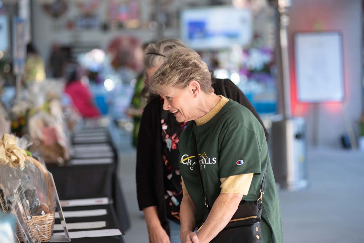 Woman looking at auction table