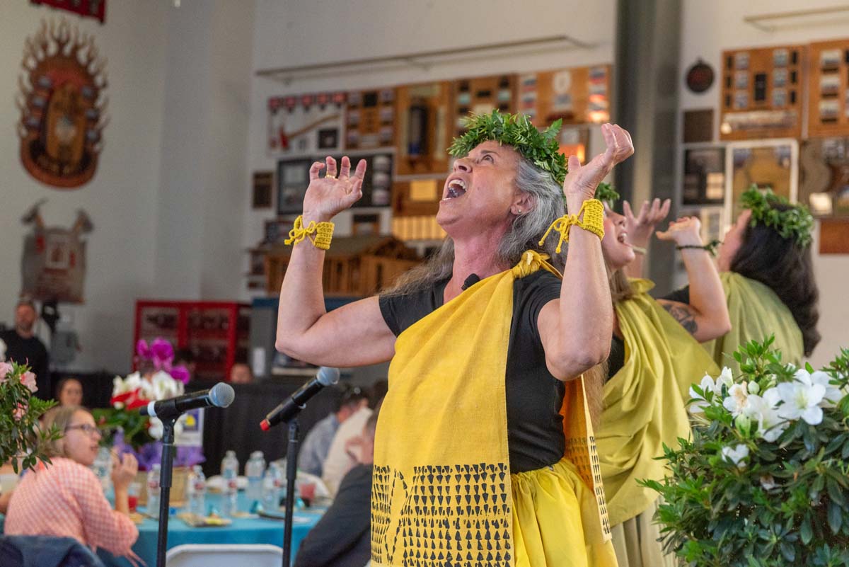 Woman in island costume making a fierce face