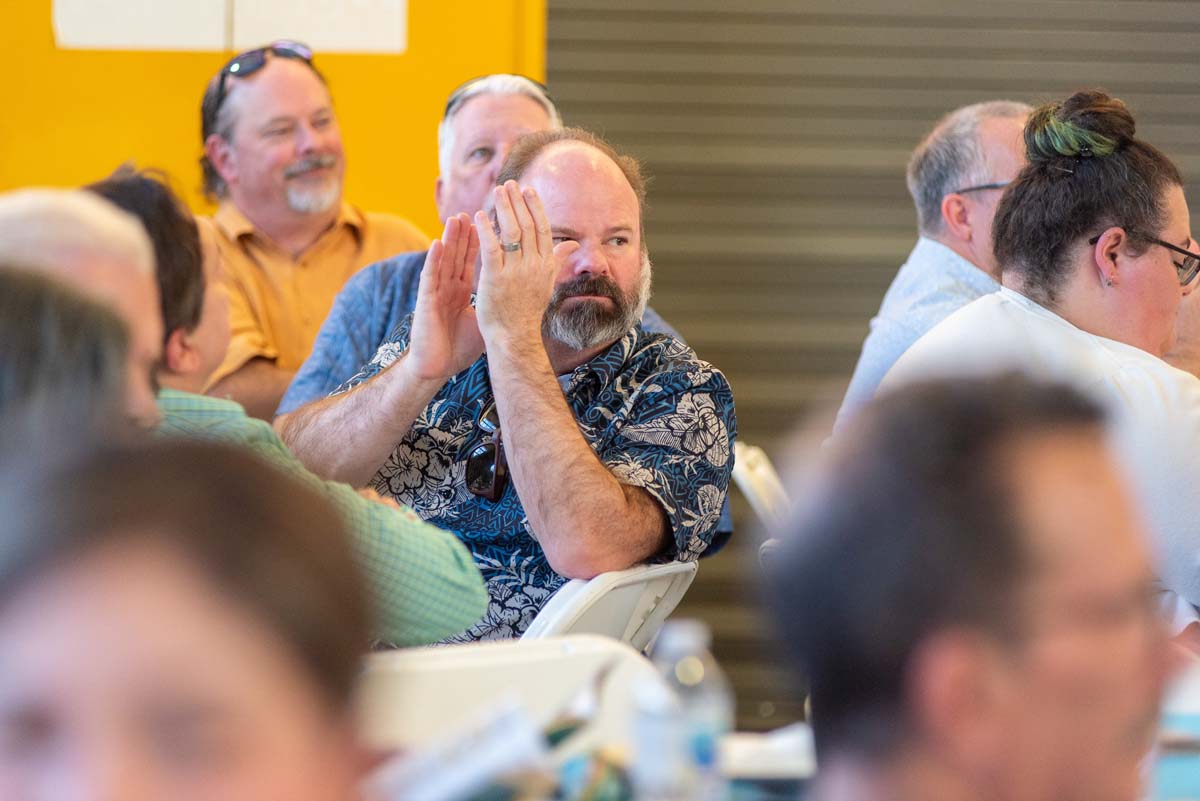 Man clapping at table