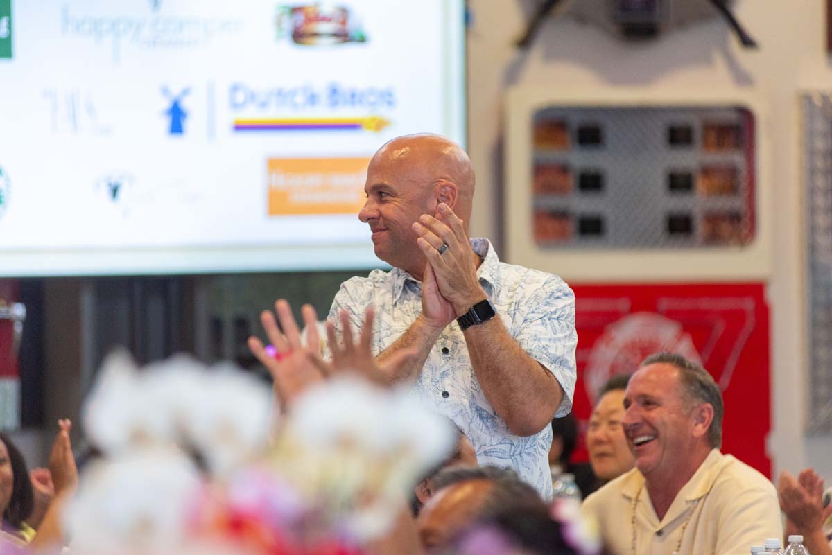 Man standing and clapping