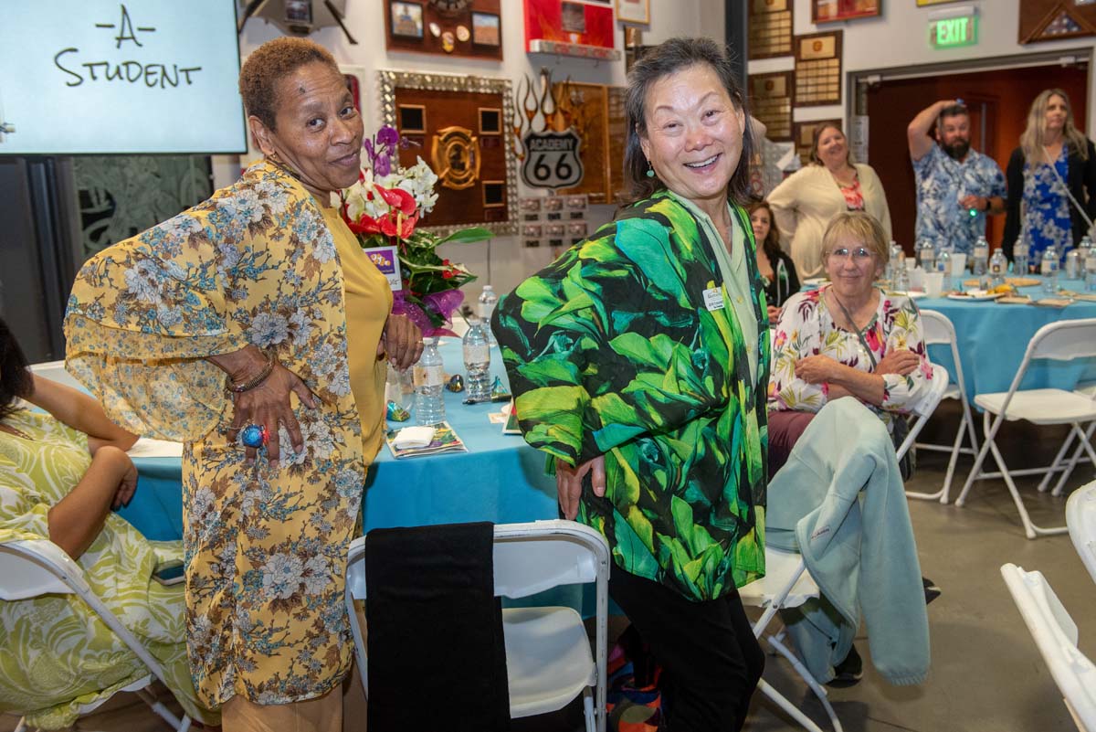 Two women with hands on their hips