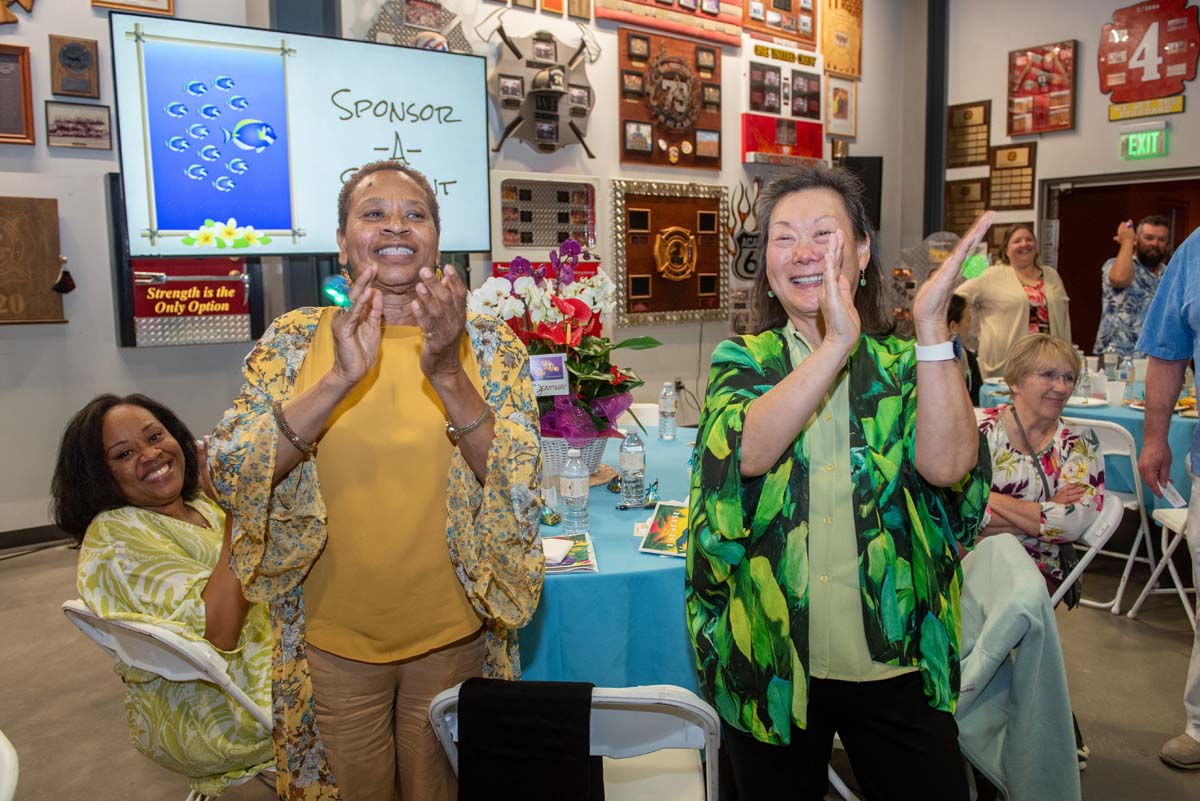 Two women clapping