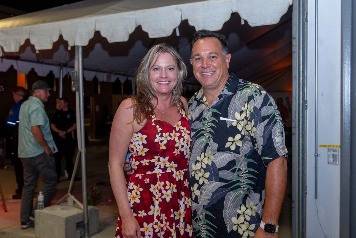 Two people next to awning