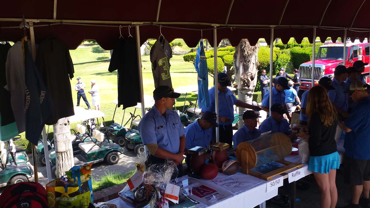 People enjoying the Fire Academy Golf Tournament
