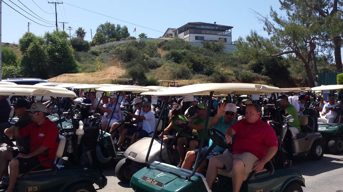 People enjoying the Fire Academy Golf Tournament