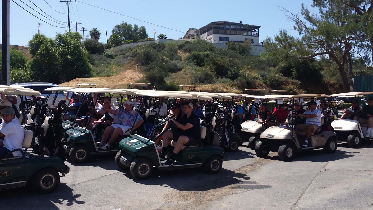 People enjoying the Fire Academy Golf Tournament
