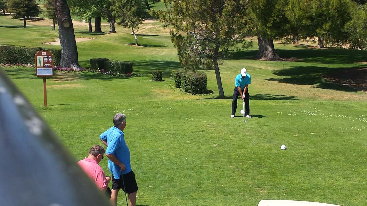 People enjoying the Fire Academy Golf Tournament