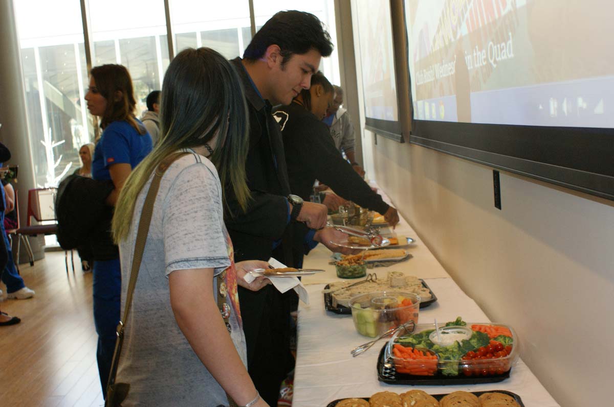People enjoying Tea With the Deans