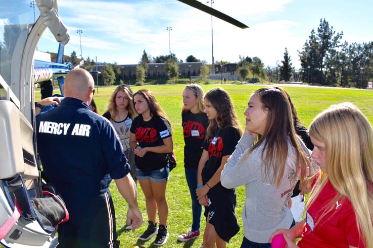 Ambulance and people at Allied Health and Medical Careers day