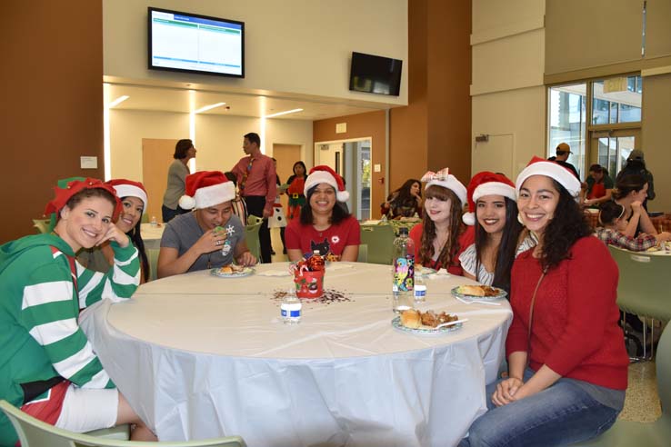 People enjoying the EOP&S Holiday Party