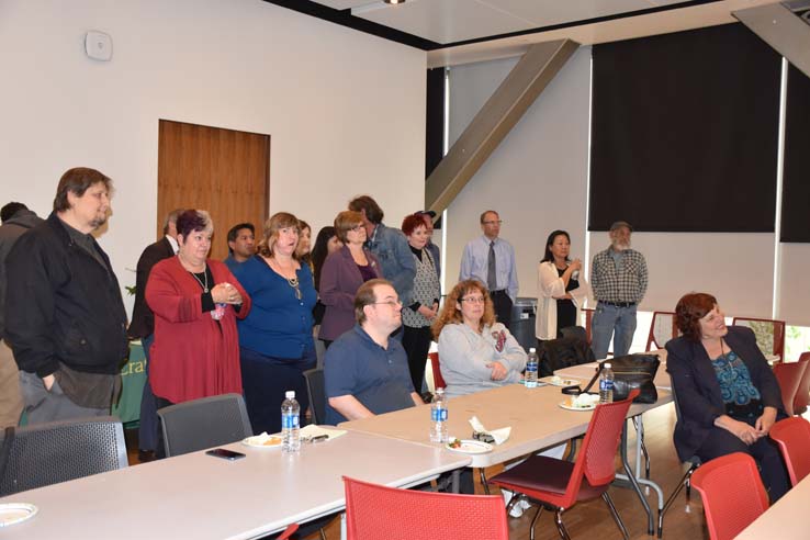 People enjoying the retirement celebration