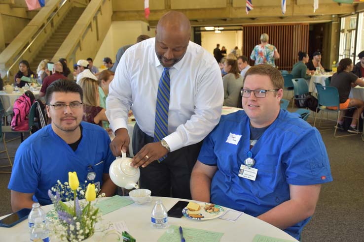 Students and faculty attend the spring Tea with the Deans event.