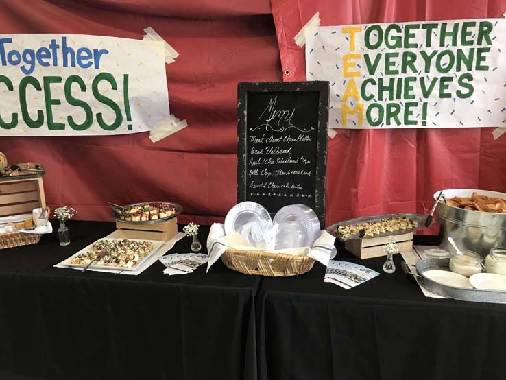 Joint Issues Mixer attendees celebrate in a group photo.