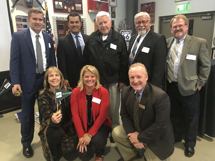 Joint Issues Mixer attendees celebrate in a group photo.