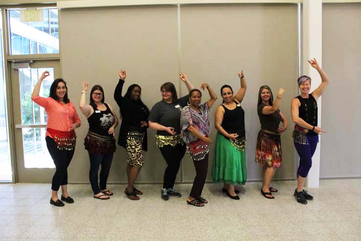 Staff practicing belly dancing