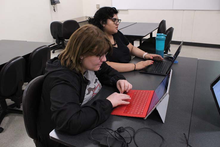 Staff practicing belly dancing