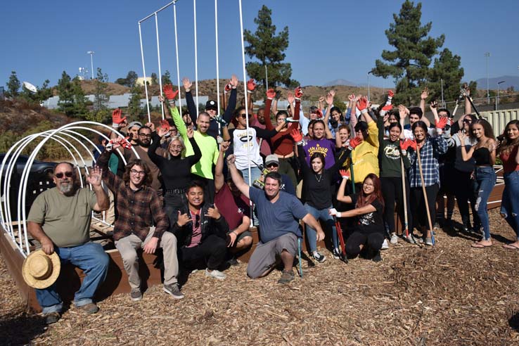 People working in the community garden