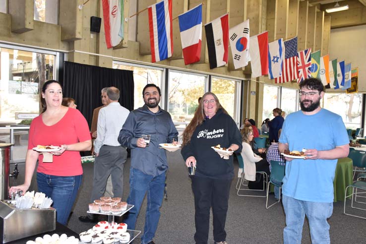 People enjoying the holiday reception