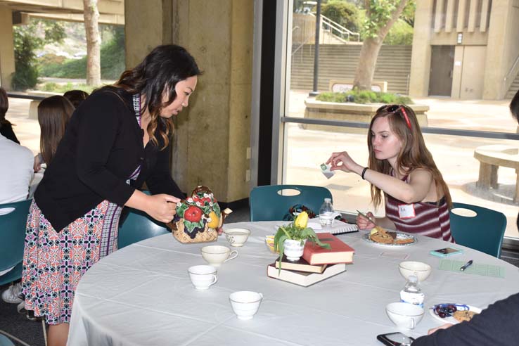 People enjoying Tea With the Deans