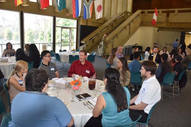 People enjoying the Etiquette Luncheon
