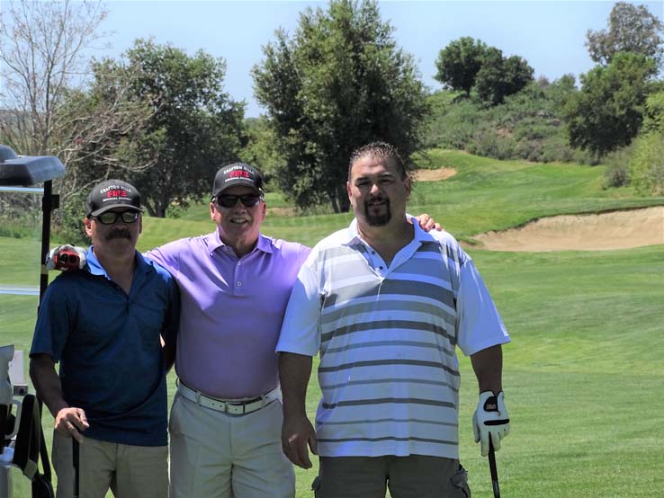 People enjoying the Fire Academy Golf Tournament