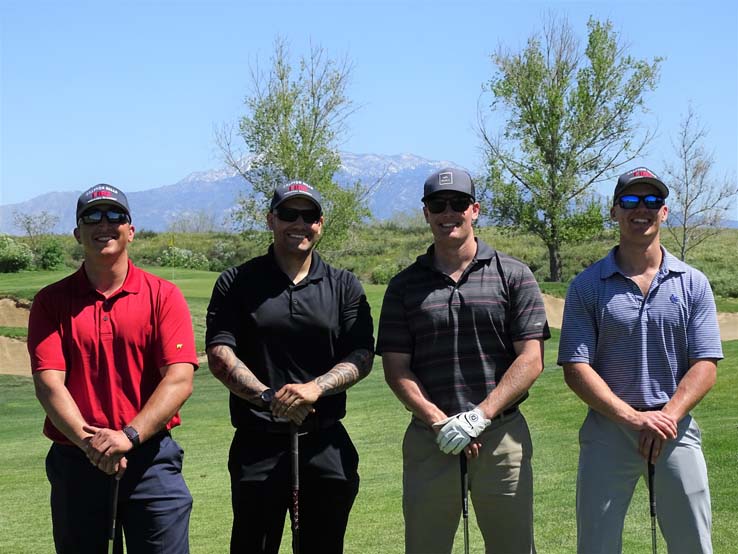 People enjoying the Fire Academy Golf Tournament