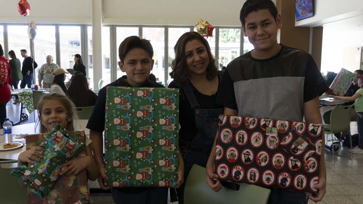 People enjoying the EOPS Holiday Celebration