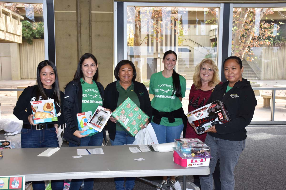 People enjoying the Holiday Wrap Party