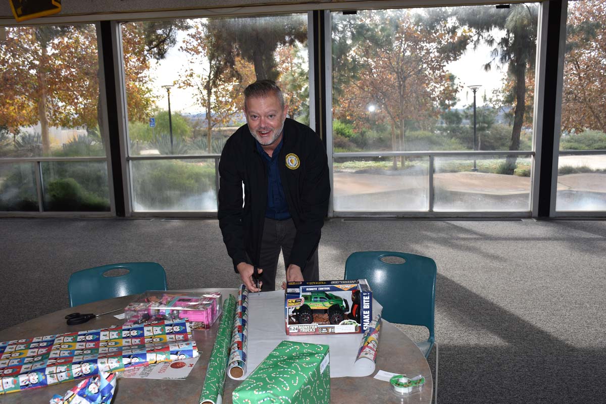People enjoying the Holiday Wrap Party