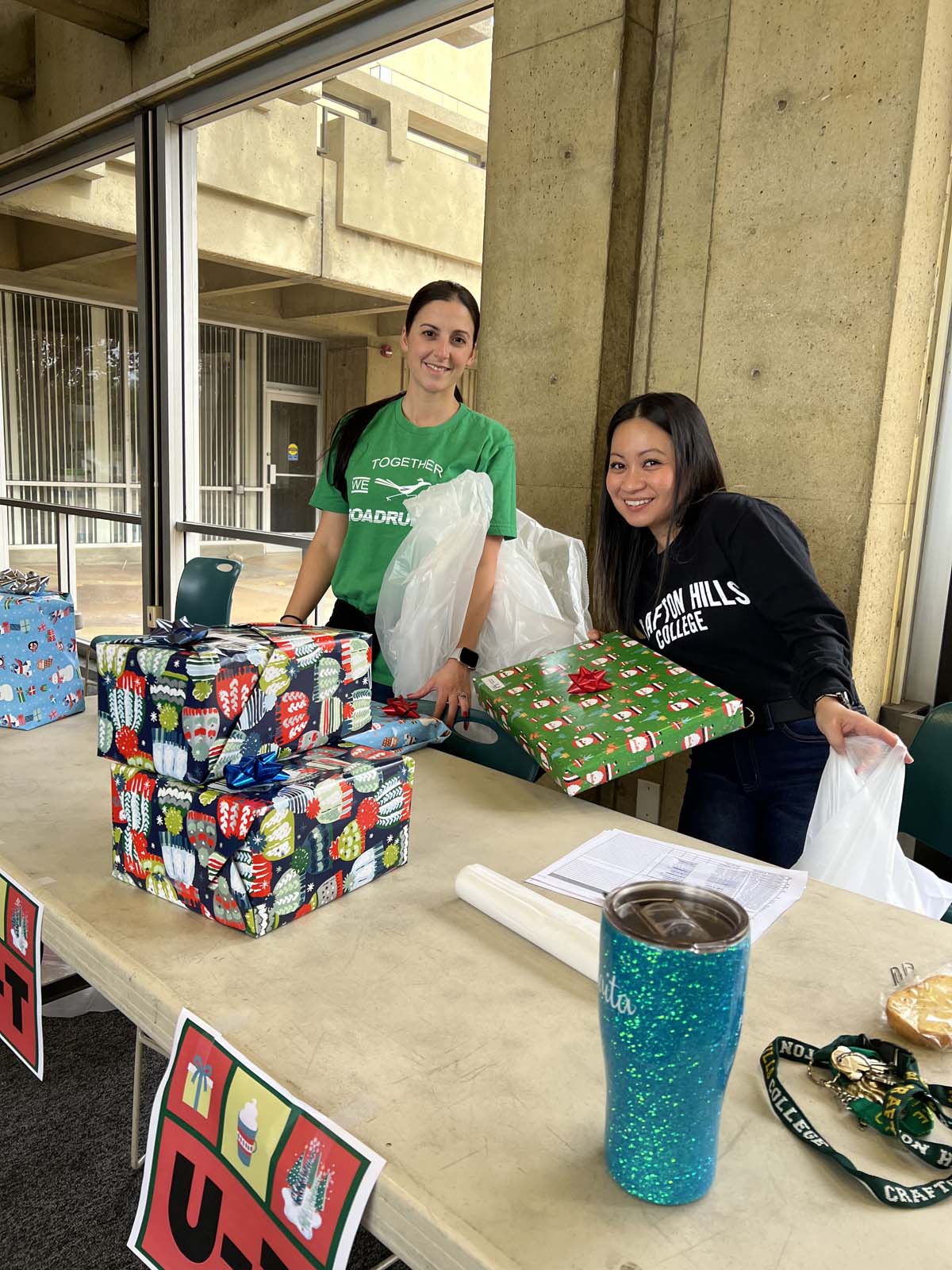 People enjoying the Holiday Wrap Party