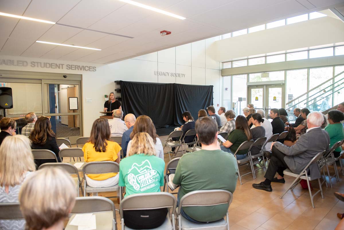 People enjoying the Legacy Wall unveiling