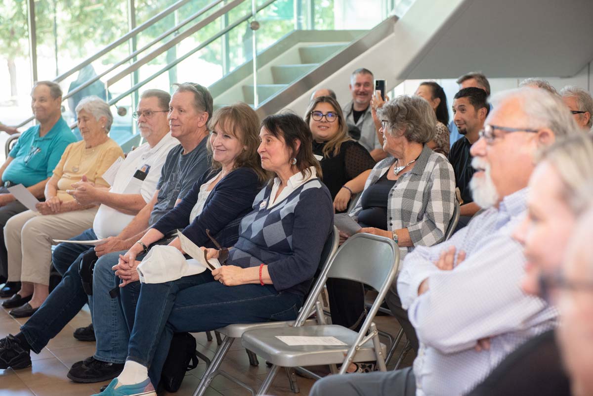 People enjoying the Legacy Wall unveiling