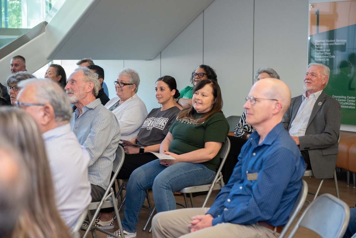 People enjoying the Legacy Wall unveiling
