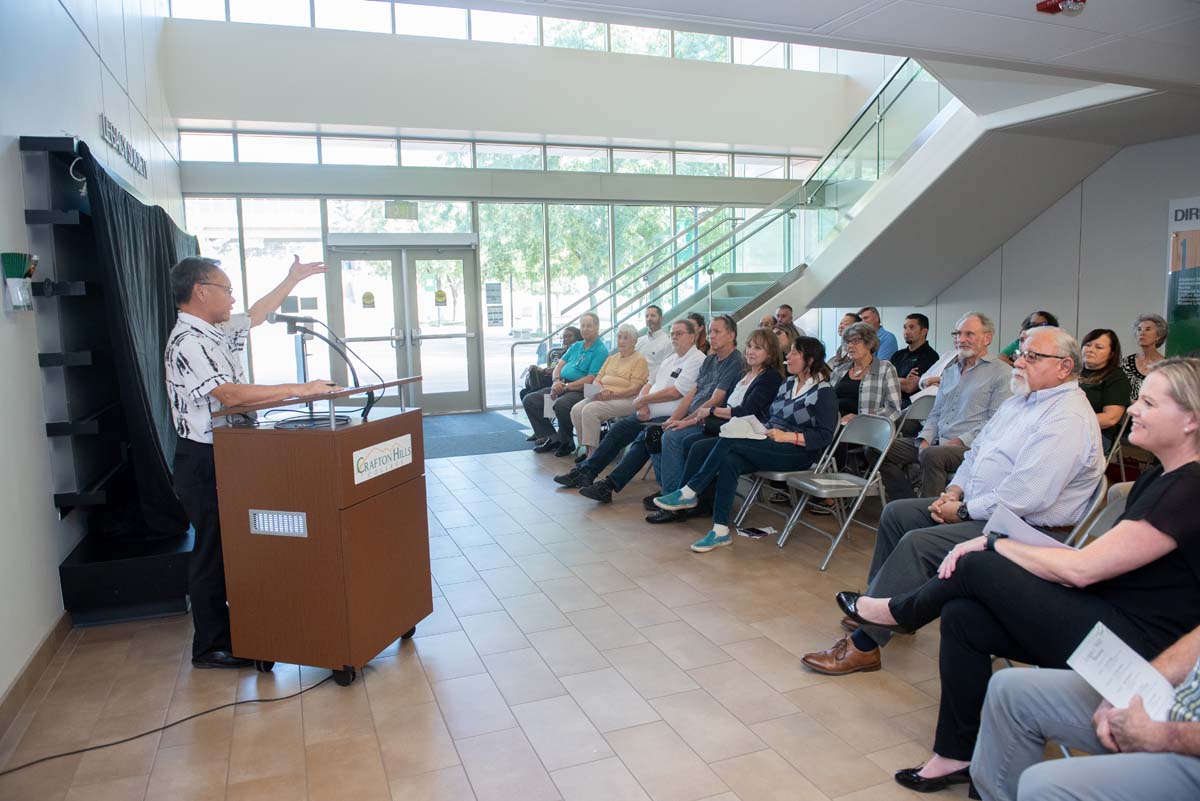People enjoying the Legacy Wall unveiling