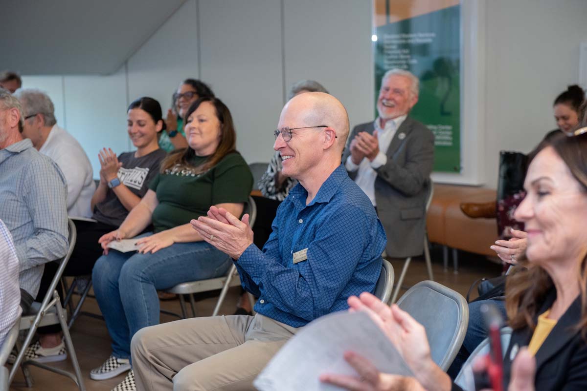 People enjoying the Legacy Wall unveiling