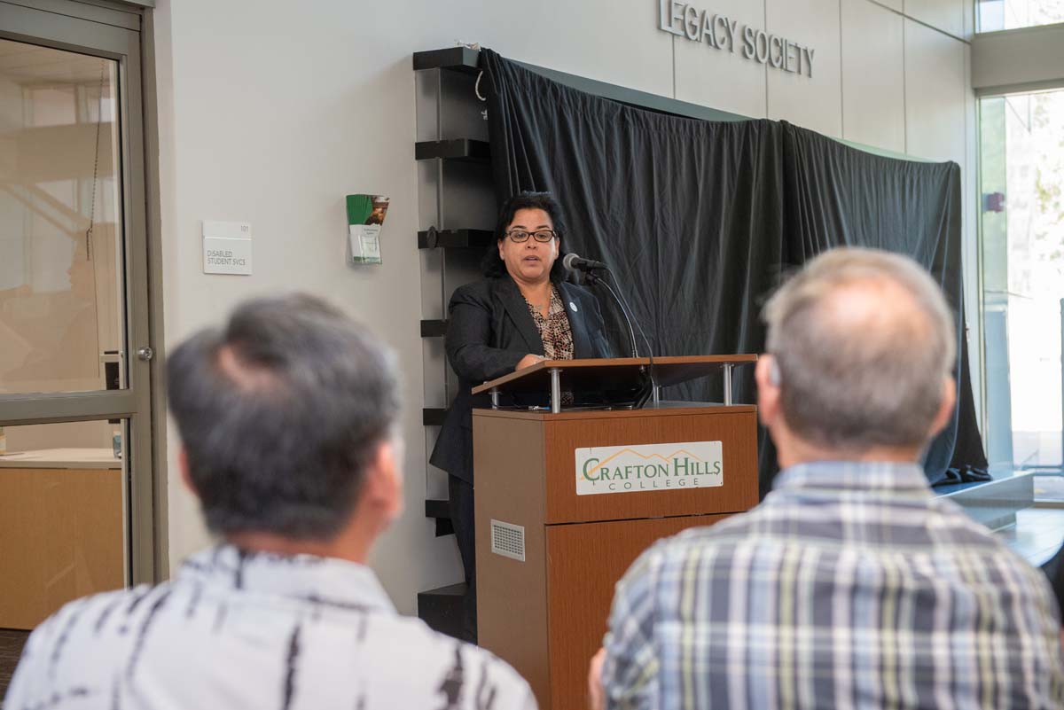 People enjoying the Legacy Wall unveiling